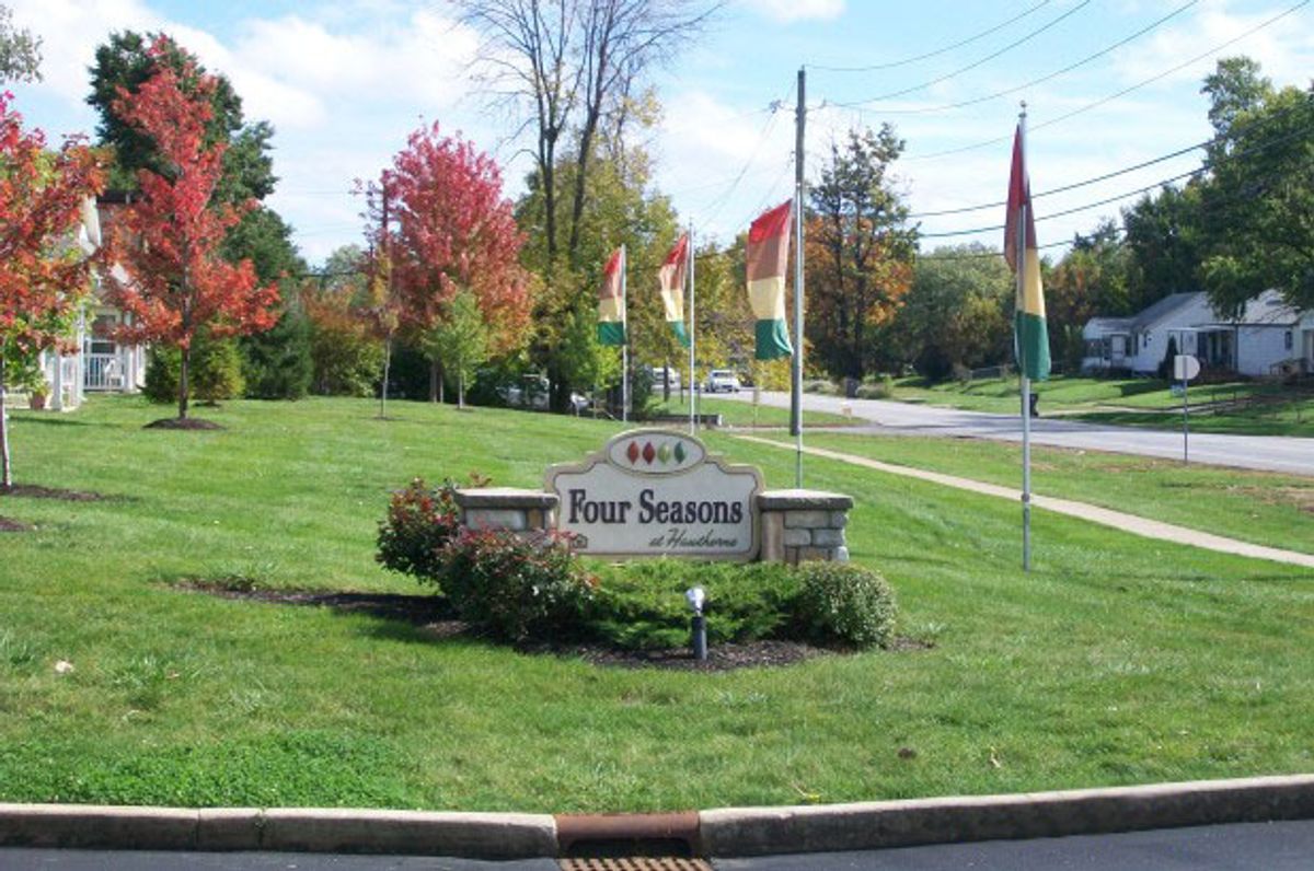 Monument sign for Four Seasons at Hawthorne Apartments, located at the community entrance.