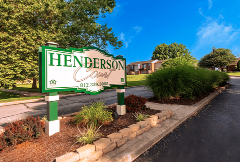 Monument sign at the entrance of Henderson Court Apartments.