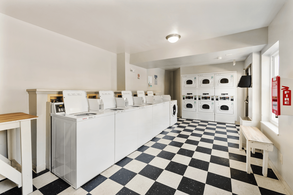 Onsite clothes care center at Windsor Park Apartments, featuring washers and dryers in a clean space for resident convenience.
