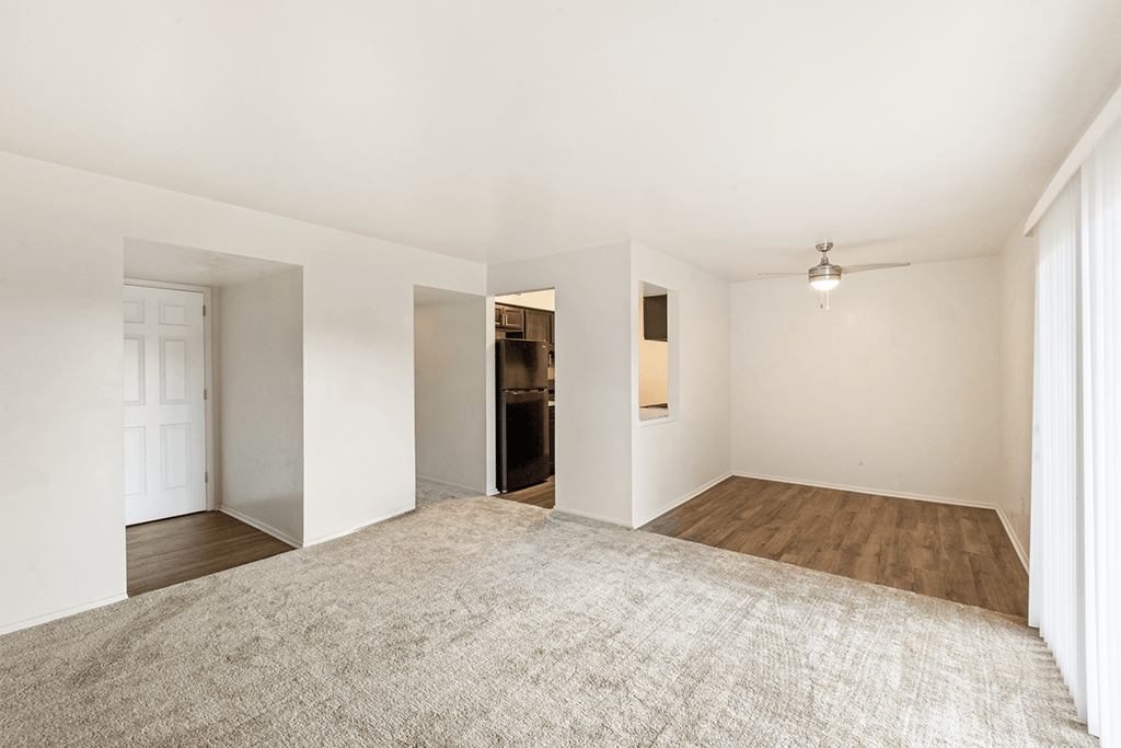 Open-concept living and dining space in a 1-bed, 1-bath apartment at Carriage House Apartments, Kendallville.