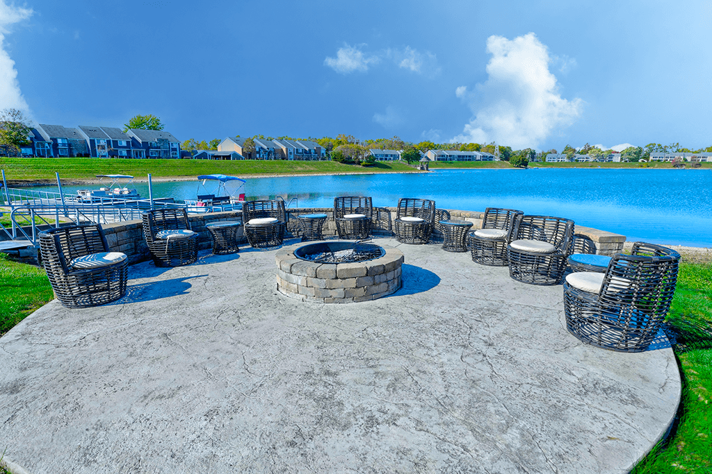 Outdoor space with a fire pit at Somerset Lakes Apartments, providing a cozy area for relaxation and gatherings.