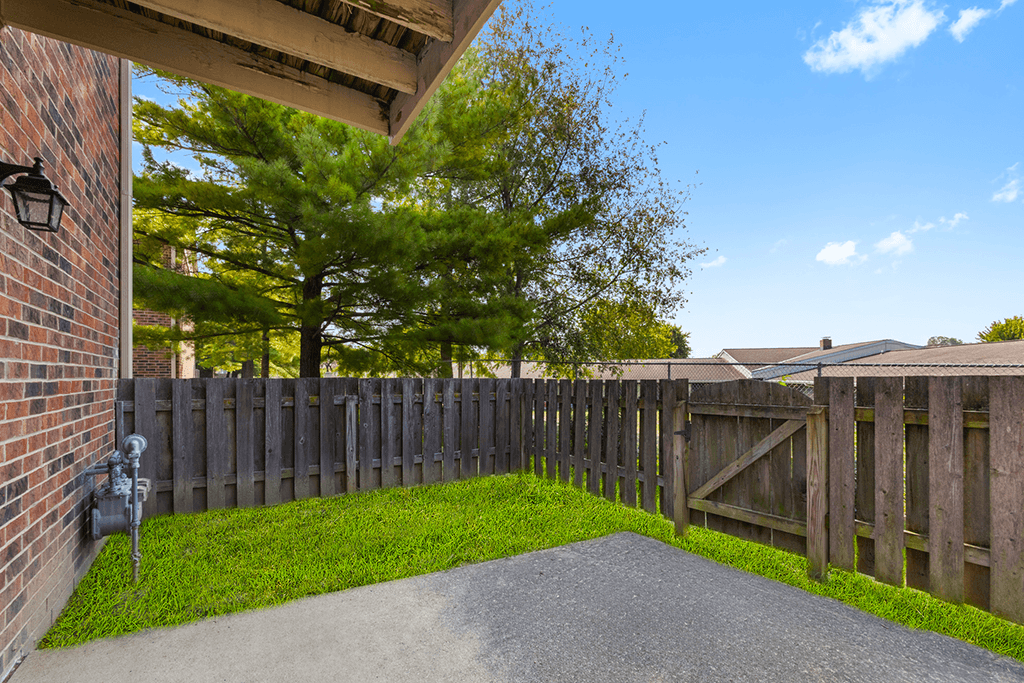 Fenced patio area in a 1-bed, 1-bath apartment at Carriage House Apartments in Kendallville.