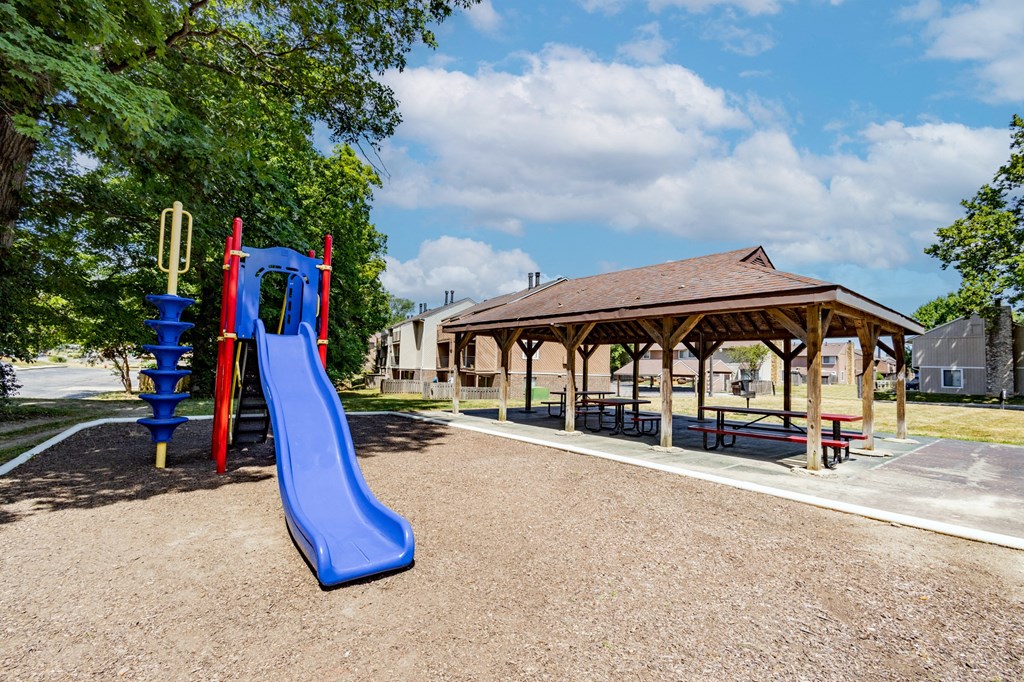 Playground with shaded pavilion at  Woodbridge Apartments