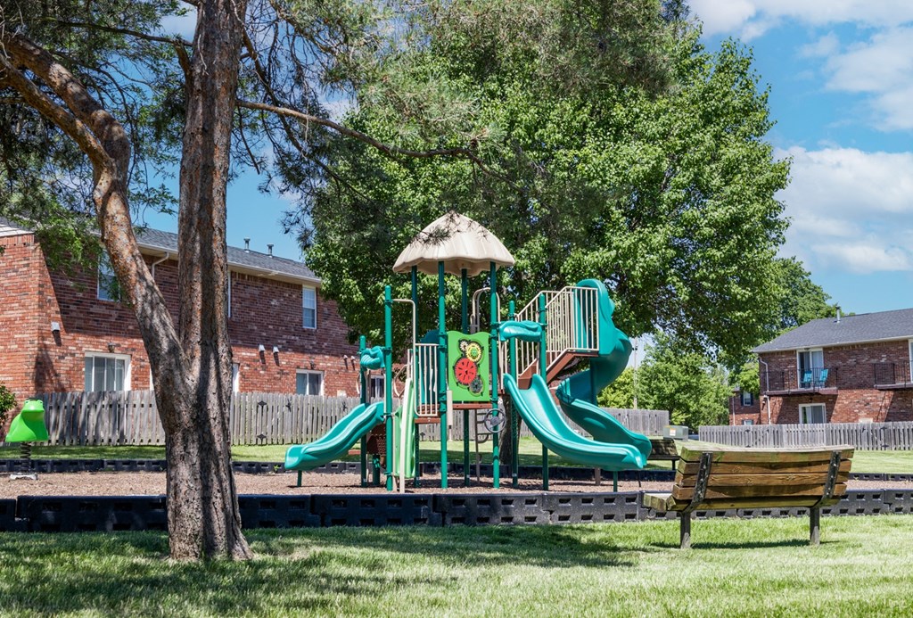 Playground with slides in a park at Archer's Pointe.