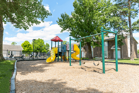 Playground with slides and swings at Northwood on the Trail.
