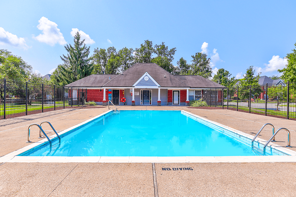 Swimming pool at Hampton Place Apartments, offering a relaxing area and clear water.