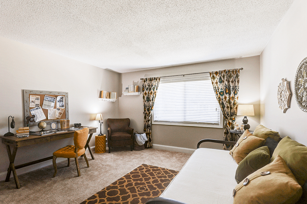 Secondary bedroom in a signature series 2-bed, 2-bath apartment at Somerset Lakes, featuring ample space and natural light.