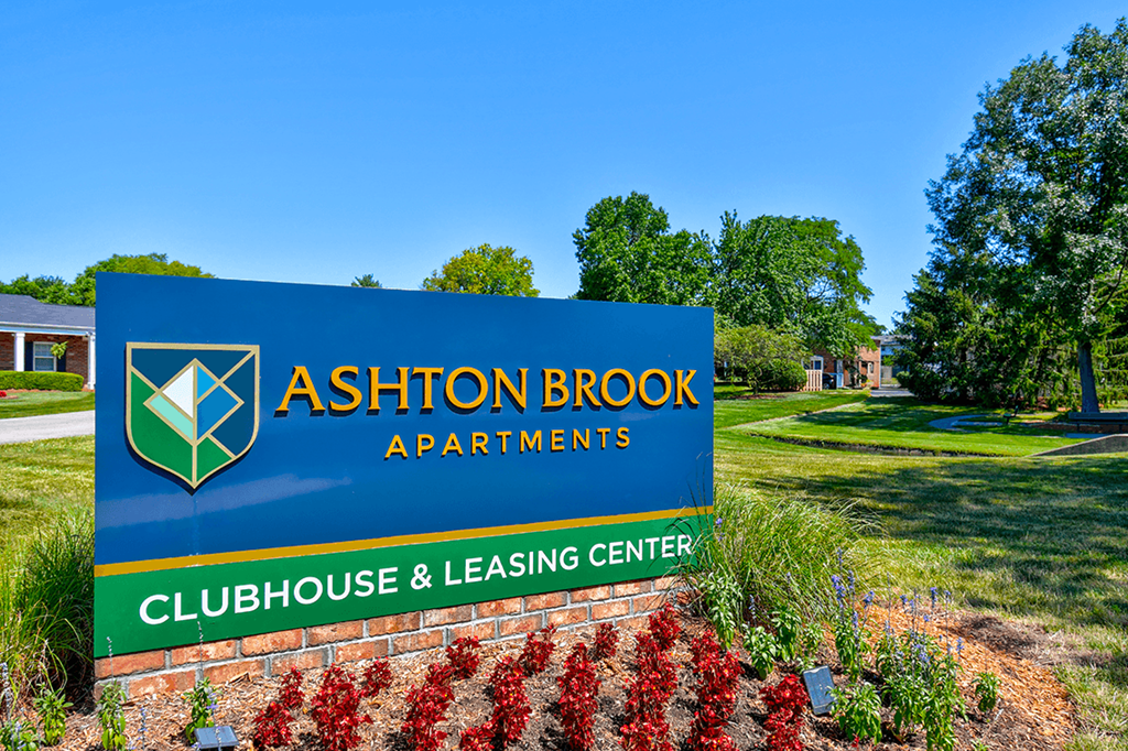 Sign for the clubhouse and leasing office at Ashton Brook Apartments, guiding residents to the community amenities.