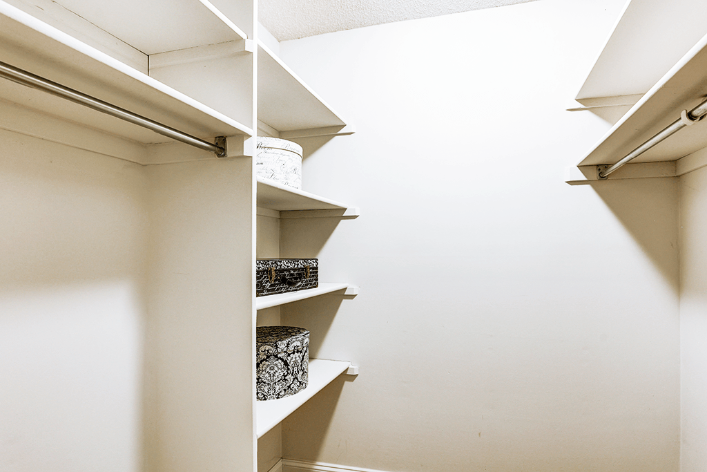 Walk-in closet in a signature series 2-bed, 2-bath apartment at Somerset Lakes, offering ample storage space.