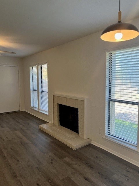 a living room with a fireplace and a window