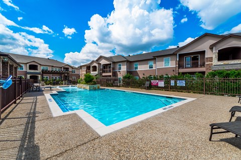 the preserve at ballantyne commons pool with apartment buildings