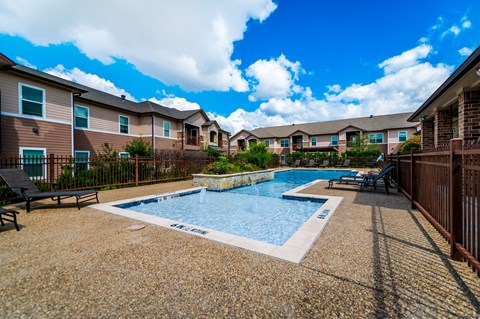 the preserve at ballantyne commons pool with apartment buildings