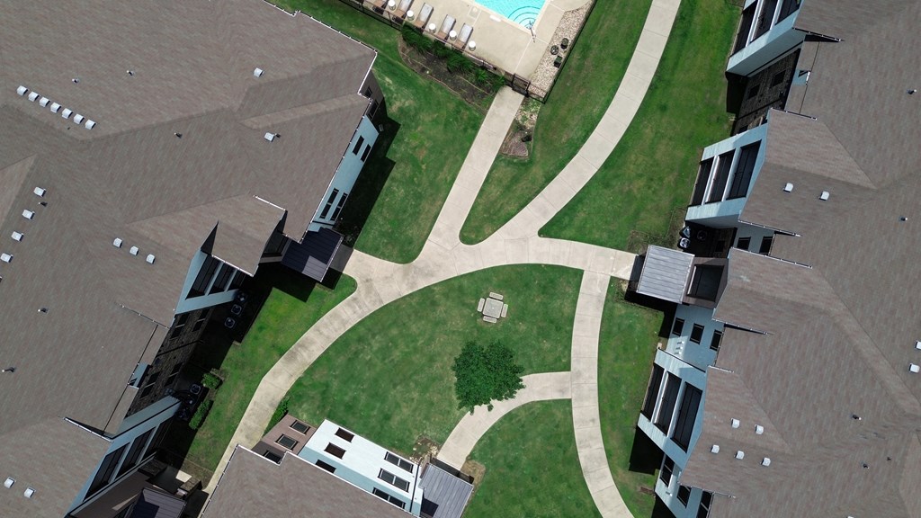 A view of a courtyard surrounded by buildings.