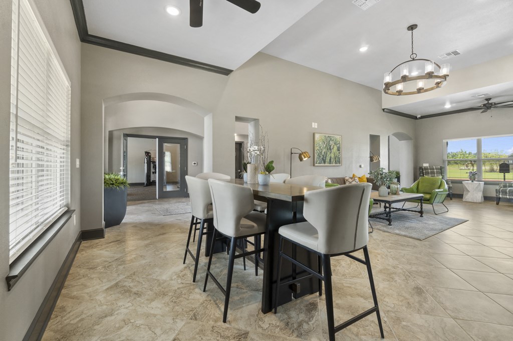 an open living room and dining room with a large table and chairs