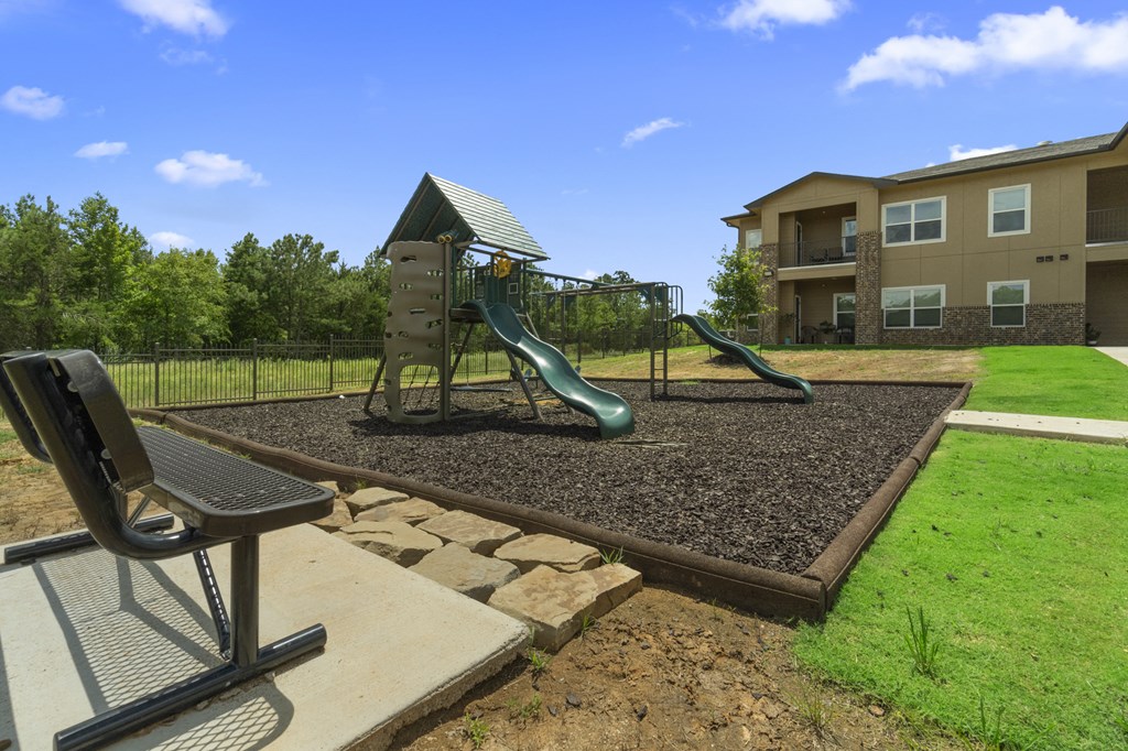 the preserve at ballantyne commons playground with slides and a swing set