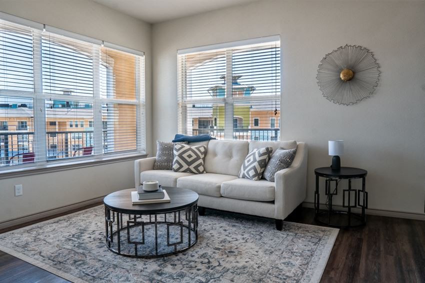 Great Lake view at Village at Lakefront in Little Elm a living room with a couch and two tables - Photo Gallery