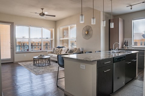 an open floor plan with a kitchen and living room