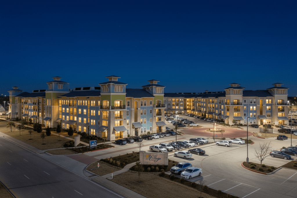 A large building with a parking lot in front of it.