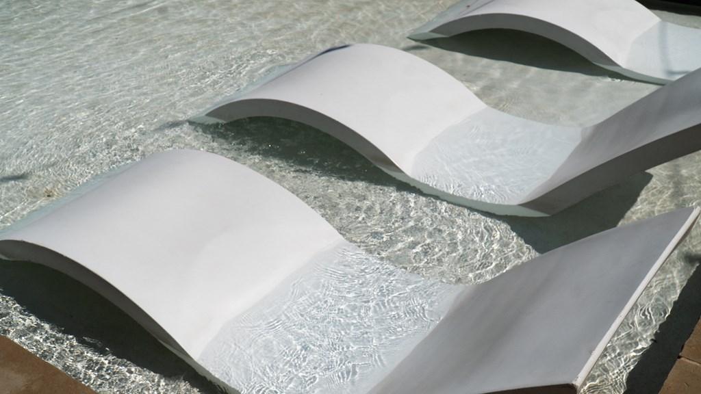 Lounge chairs in the swimming  pool