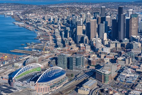 an aerial view of the city with the convention center and the stadium