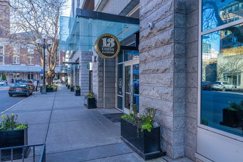 the facade of 18 condos on a city street