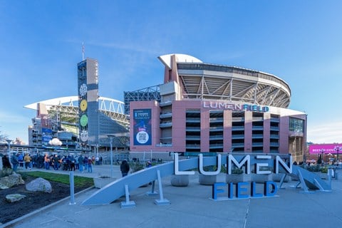 a view of the front financial field in front of a large stadium