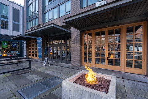 a fire pit in front of a building