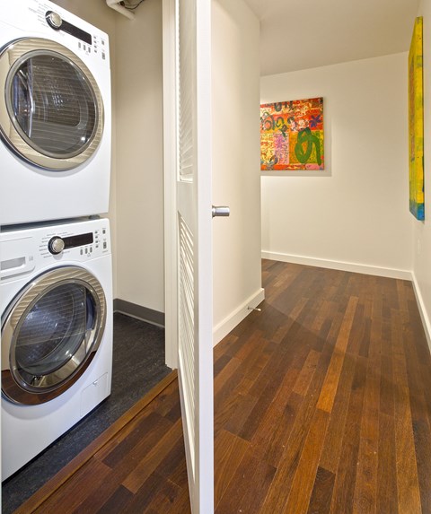 a washer and dryer in a laundry room next to a door