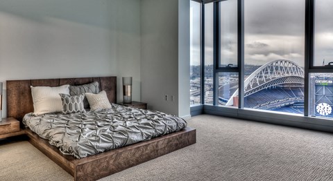 a bedroom with a view of the sydney harbour bridge