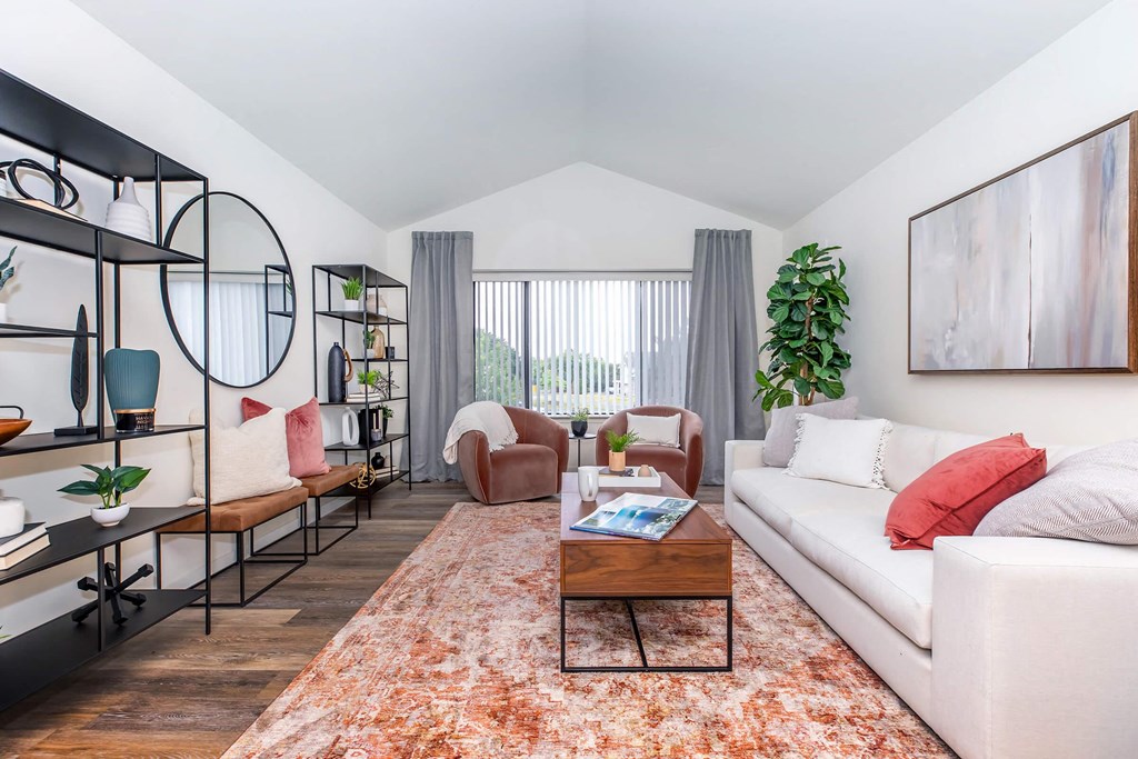 a living room with a white couch and a coffee table