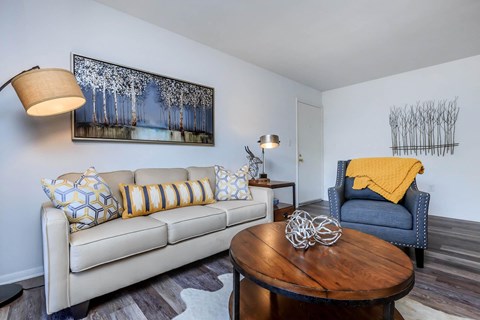 a living room with a couch and a table