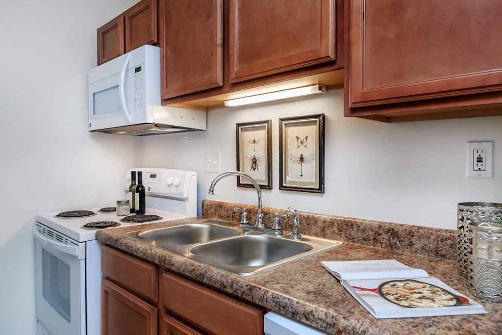 a kitchen with a sink and a microwave