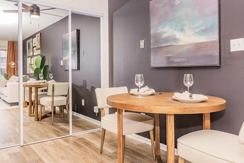 a dining room with a table and chairs