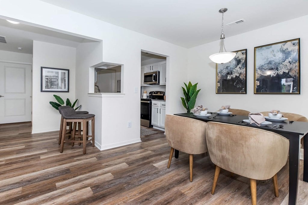 a dining room with a table and chairs