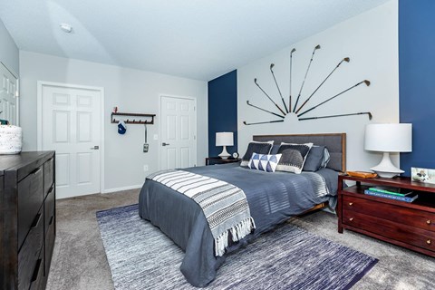 a bedroom with a bed and a dresser