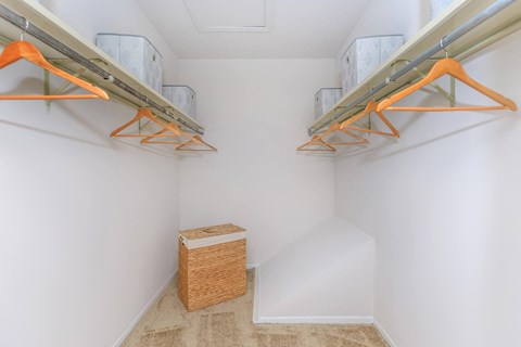 A room with a white wall and a brown box on the floor.