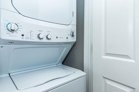 a white washer and dryer in a laundry room