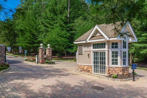 a small house sitting on the side of a road