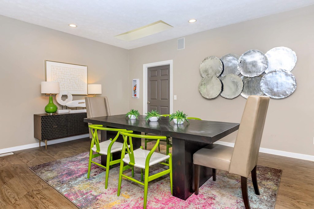 a dining room with a table and chairs