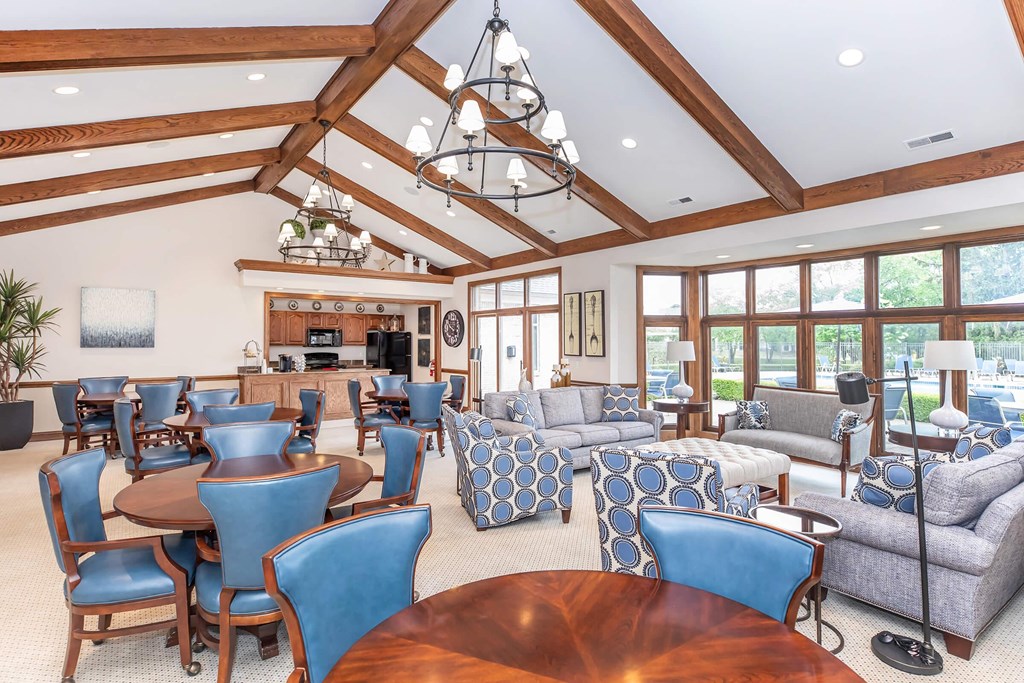 a living room with couches and chairs and a table