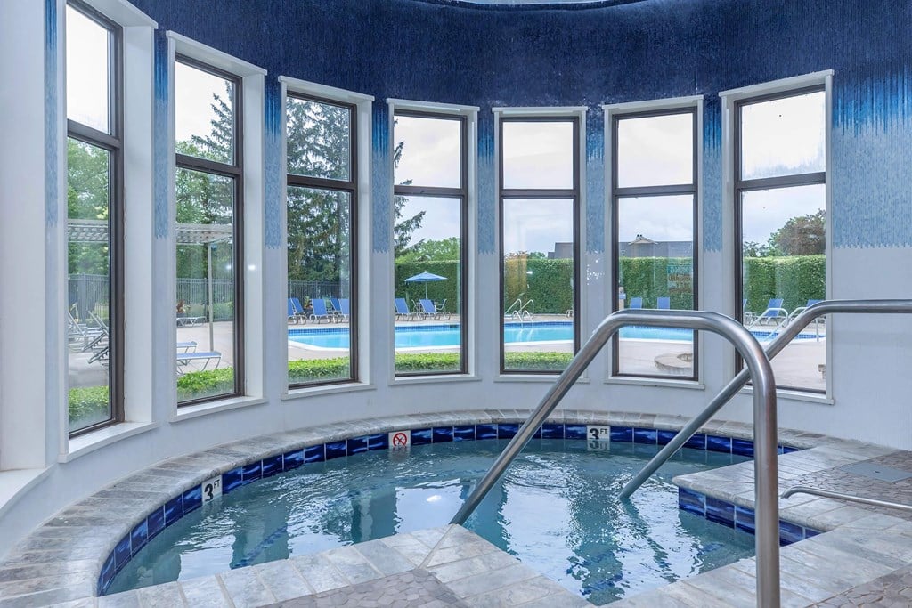 a swimming pool with a large number of windows