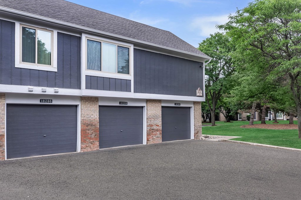 the front of a house with three garage doors