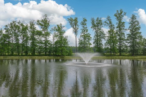 a fountain in the middle of a lake