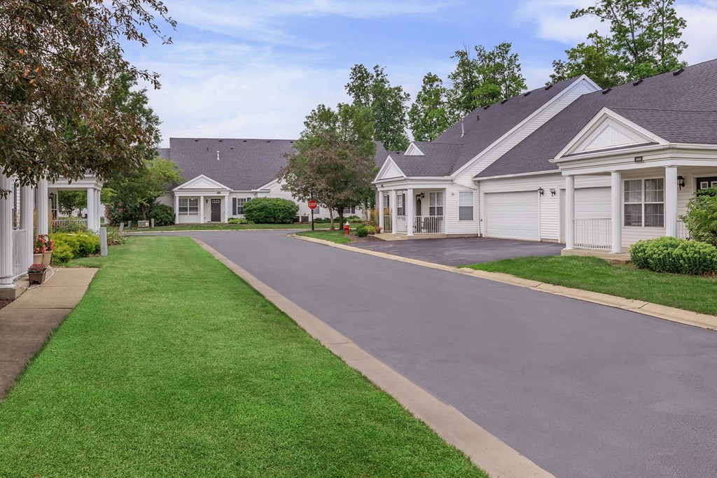 an empty street in front of a row of houses