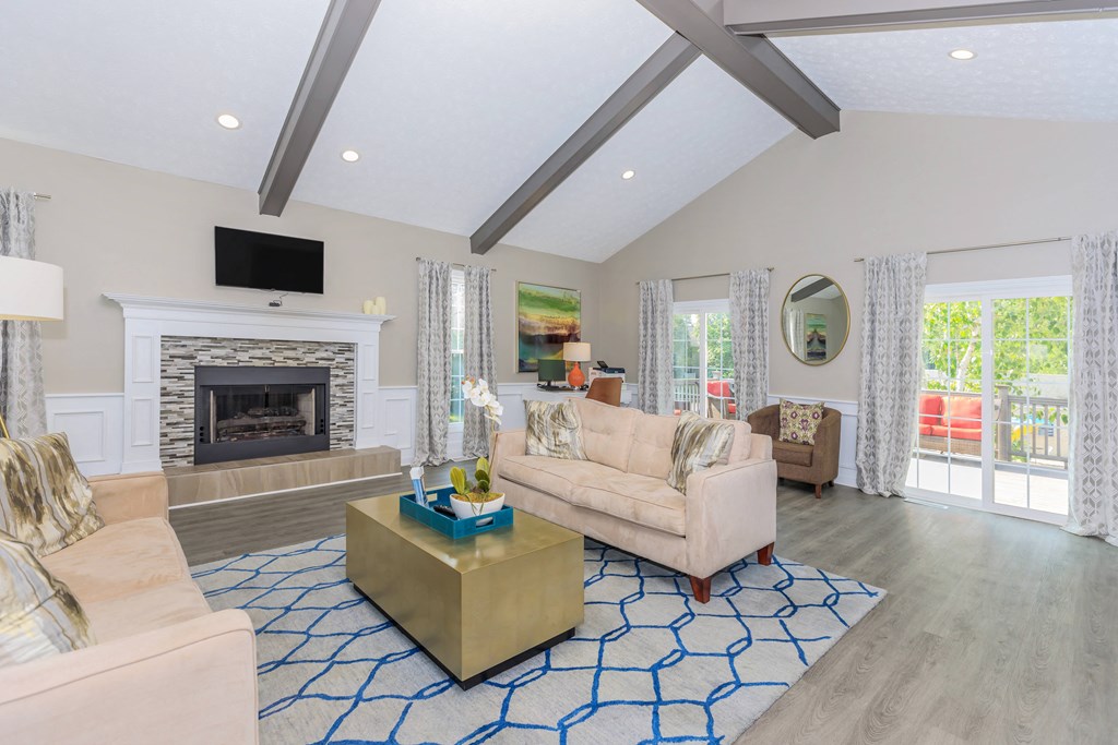 a living room with couches and a fireplace