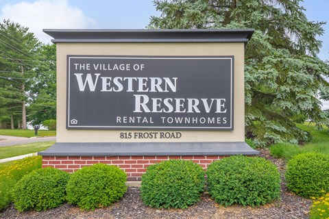 a sign for the village rental townhomes