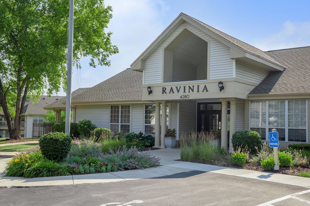 the front of the building with a blue parking meter