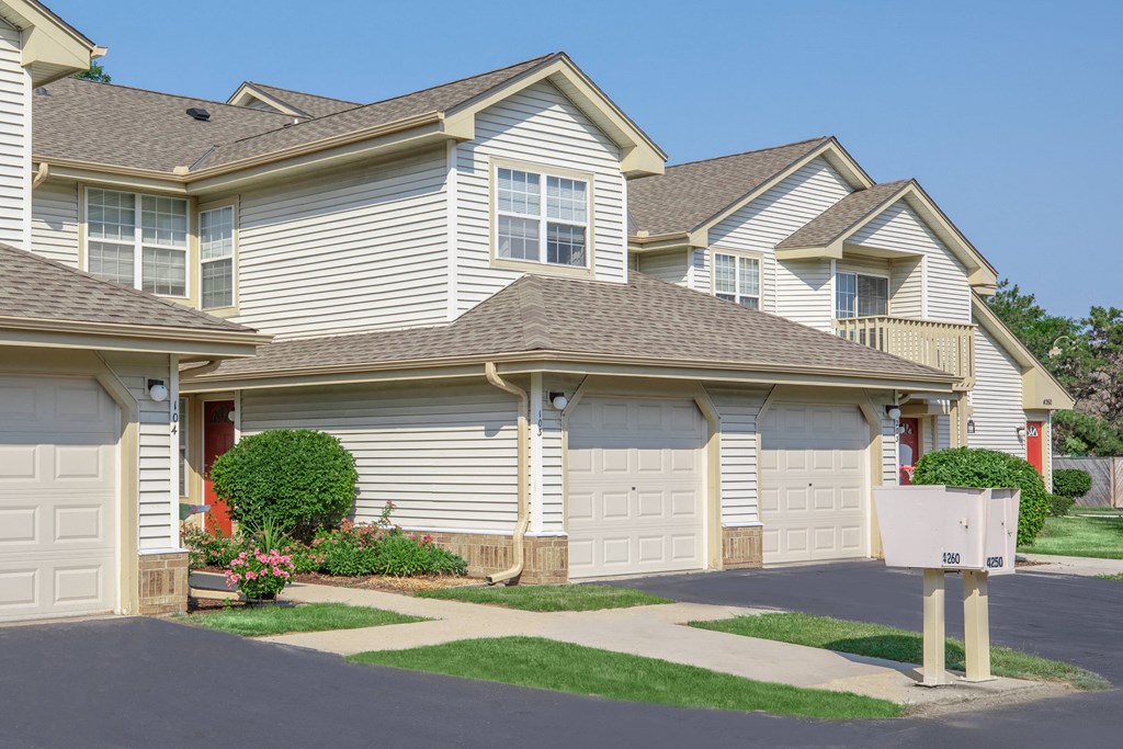 a house with two garages in front of it
