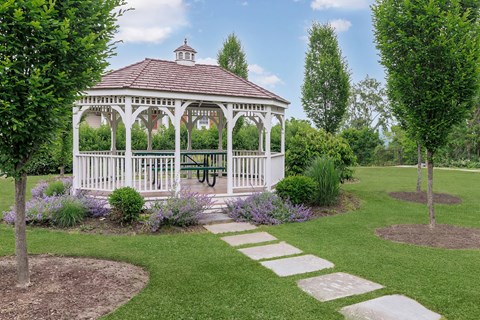 a gazebo in the middle of a garden