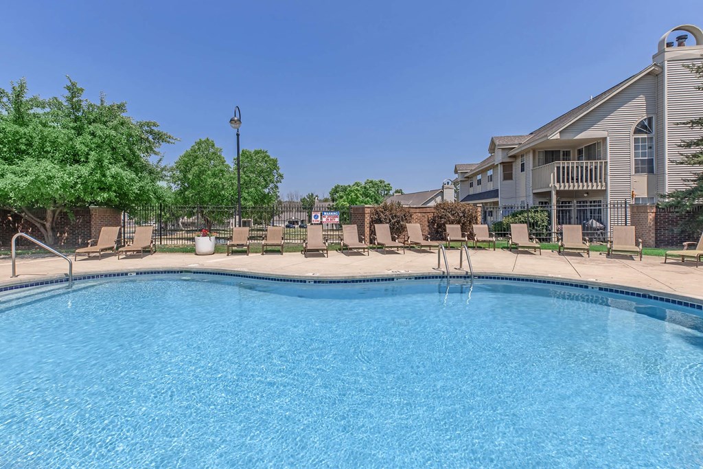 our apartments have a large swimming pool with chairs